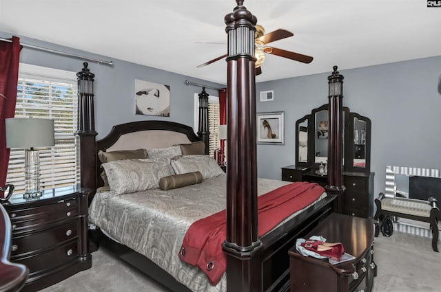 bedroom with carpet floors, visible vents, and a ceiling fan