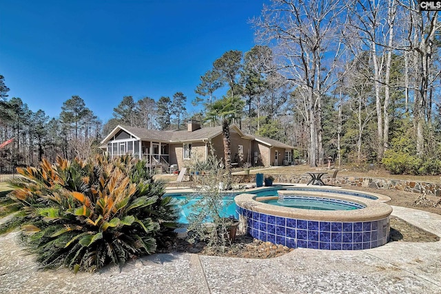 pool with an in ground hot tub