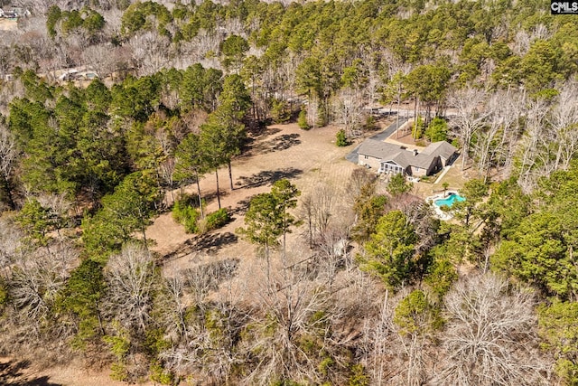 birds eye view of property with a forest view