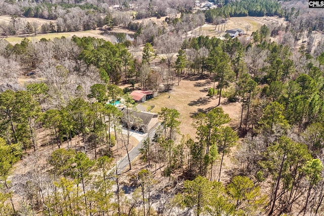 bird's eye view featuring a wooded view