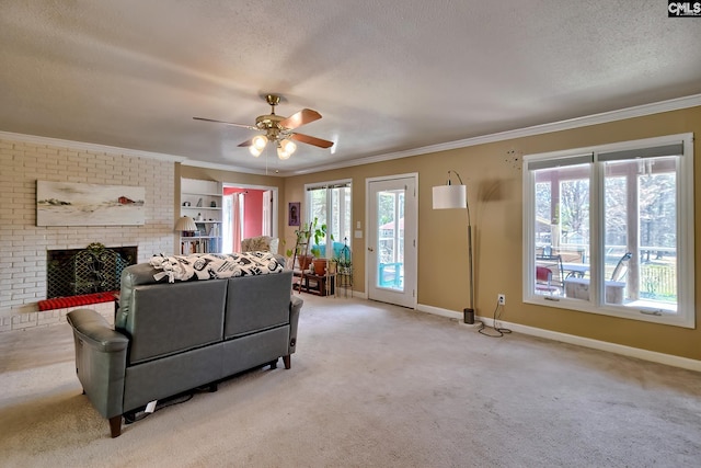 living area with crown molding, a wealth of natural light, a fireplace, and a textured ceiling