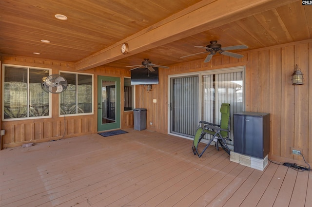 wooden terrace featuring a ceiling fan