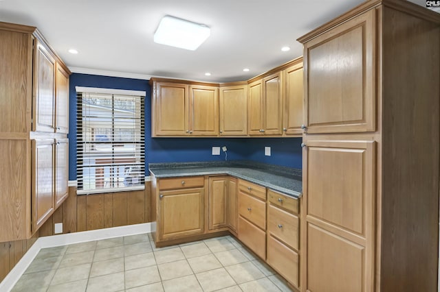 kitchen with dark countertops, recessed lighting, and light tile patterned floors