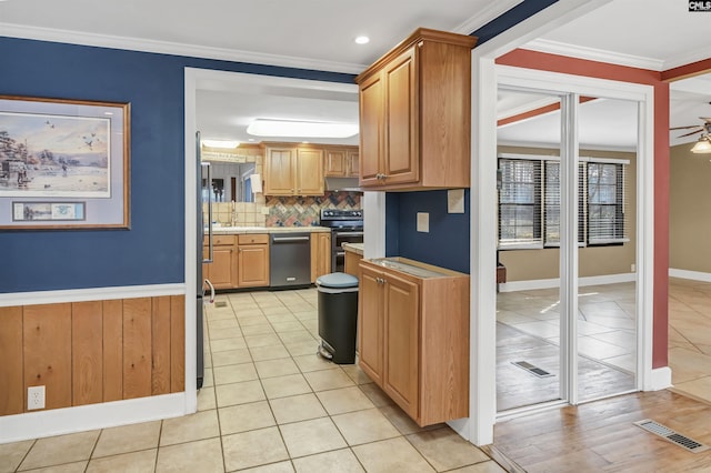 kitchen with visible vents, stainless steel appliances, crown molding, and light tile patterned flooring