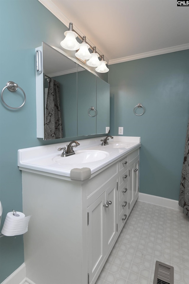 full bath with crown molding, a sink, and baseboards