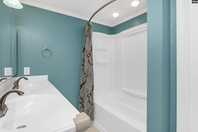 full bathroom with ornamental molding, shower / bath combo, and a sink