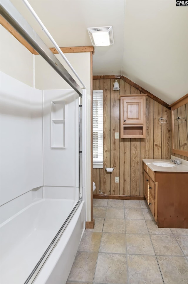 full bath featuring lofted ceiling, visible vents, toilet, wood walls, and vanity