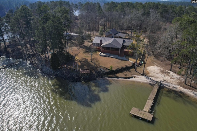 bird's eye view featuring a water view and a view of trees