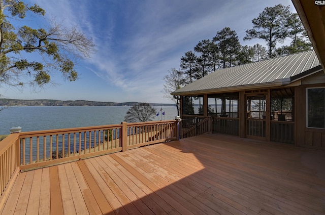 view of dock featuring a deck with water view