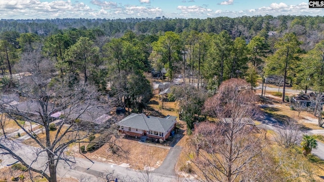 aerial view featuring a wooded view