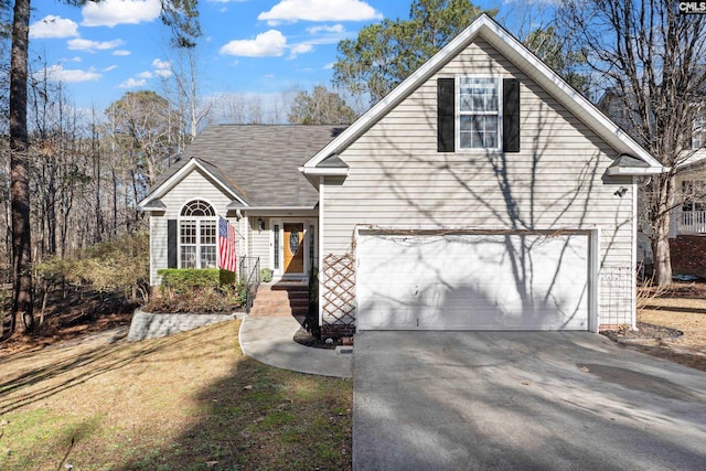 view of front of home featuring a garage and concrete driveway