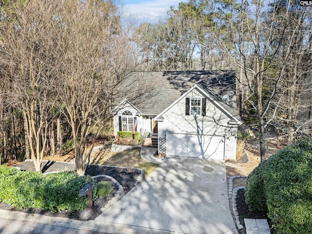 view of front of house with concrete driveway and an attached garage