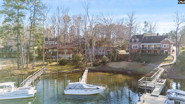 dock area featuring a water view and stairway