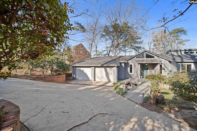 view of front facade featuring an attached garage and concrete driveway