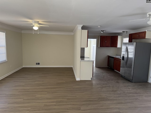 kitchen with visible vents, dark wood-style floors, ceiling fan, stainless steel appliances, and crown molding