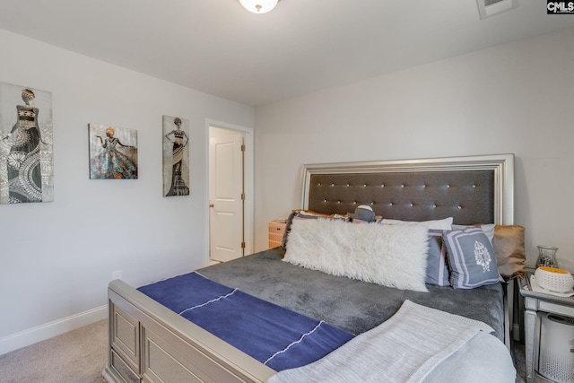 bedroom with light carpet, visible vents, and baseboards