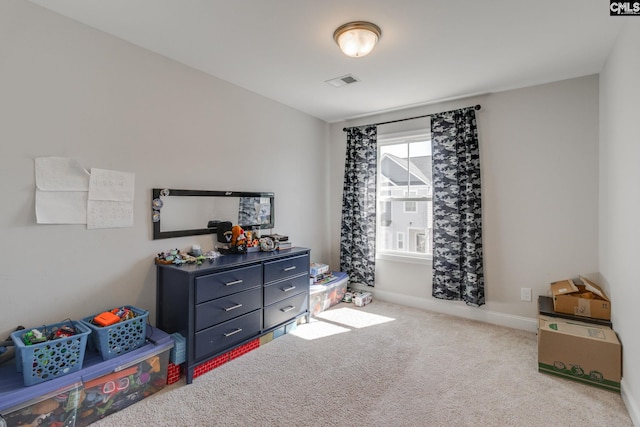 interior space featuring carpet, visible vents, and baseboards