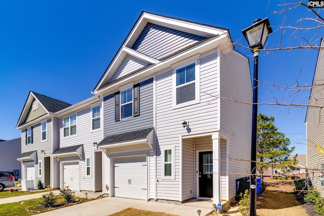 townhome / multi-family property featuring an attached garage