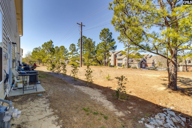 view of yard with central AC