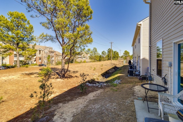 view of yard featuring central AC unit