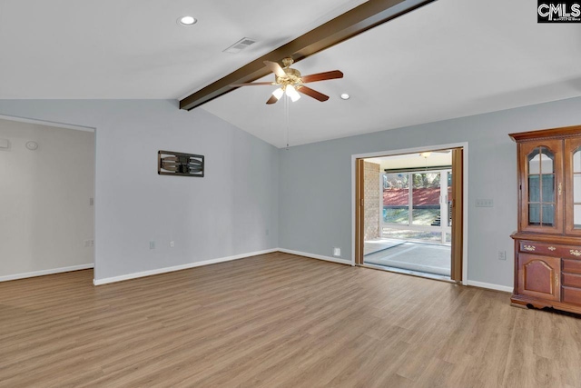 spare room featuring visible vents, vaulted ceiling with beams, light wood-style floors, and a ceiling fan