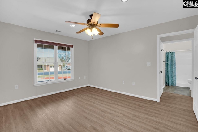 spare room with visible vents, baseboards, recessed lighting, wood finished floors, and a ceiling fan