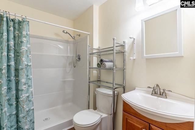 full bath with a shower with shower curtain, toilet, and vanity