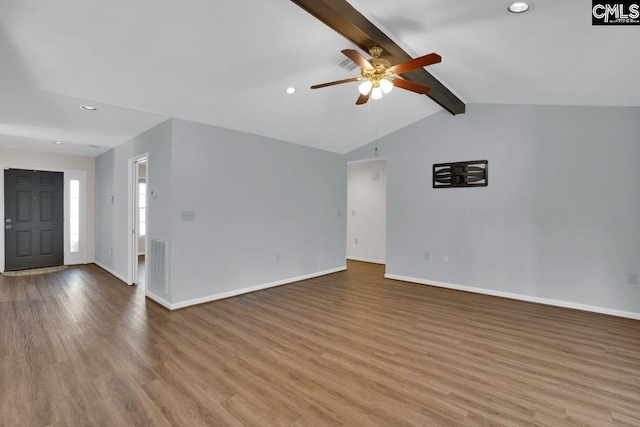 unfurnished living room with visible vents, light wood-style flooring, baseboards, ceiling fan, and vaulted ceiling with beams