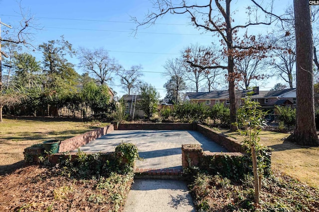 view of property's community with a yard