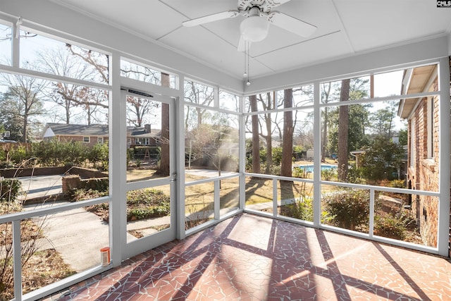 sunroom with a ceiling fan