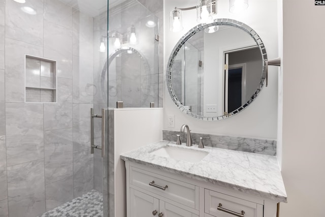 bathroom with a stall shower and vanity