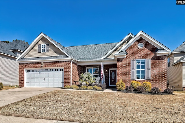 craftsman-style house with a garage, driveway, brick siding, and a shingled roof