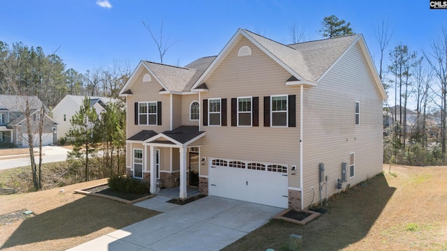 view of front of house featuring a garage, concrete driveway, a front lawn, and a shingled roof