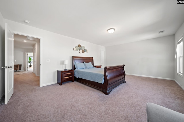 carpeted bedroom with baseboards and visible vents