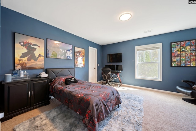 bedroom featuring carpet floors, visible vents, and baseboards