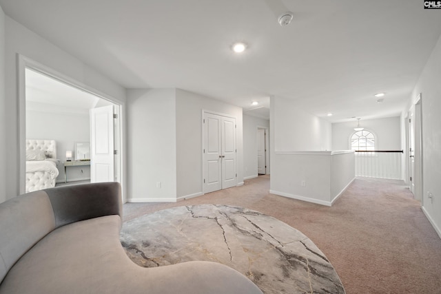 carpeted bedroom with a closet, recessed lighting, and baseboards