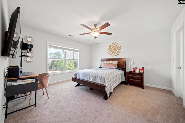 bedroom featuring carpet floors, visible vents, ceiling fan, and baseboards