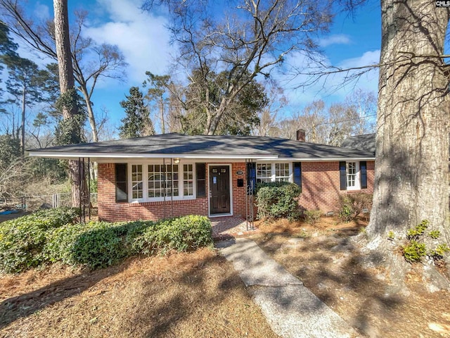 ranch-style house with brick siding