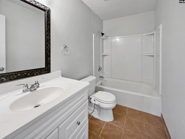 bathroom with toilet, vanity,  shower combination, and tile patterned floors