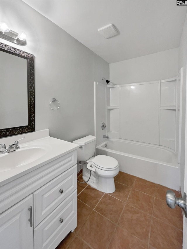 bathroom featuring tile patterned flooring, vanity, toilet, and bathing tub / shower combination