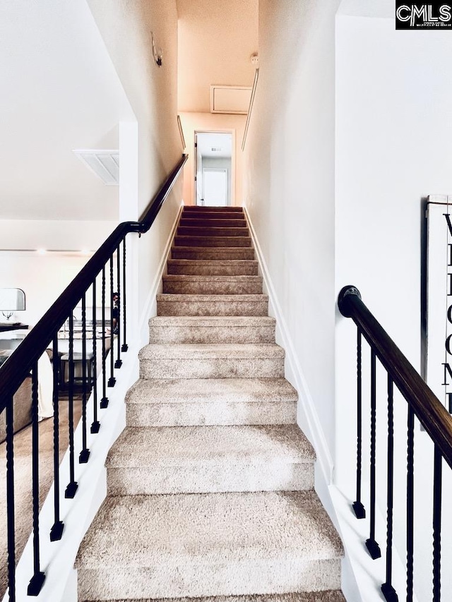 stairs featuring baseboards