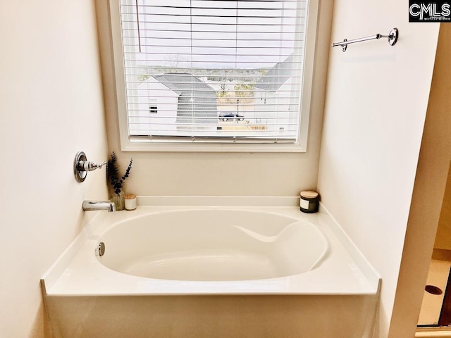 bathroom with a garden tub