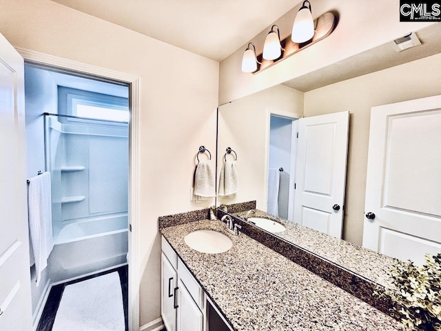 full bathroom with shower / bath combination and vanity