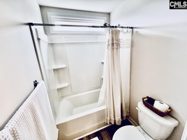 bathroom with shower / bath combo and toilet