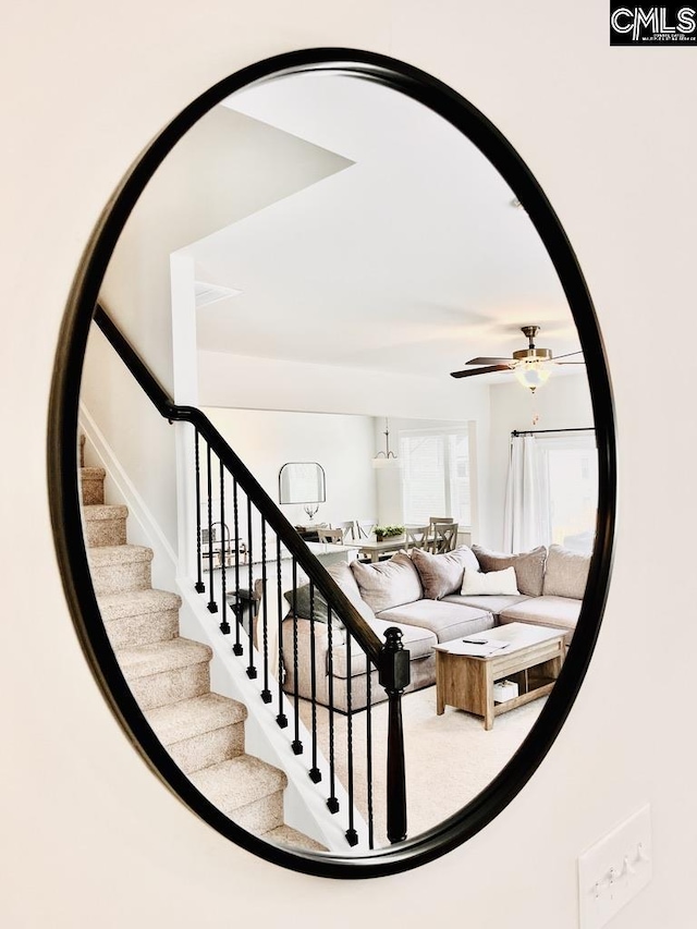 stairs with ceiling fan