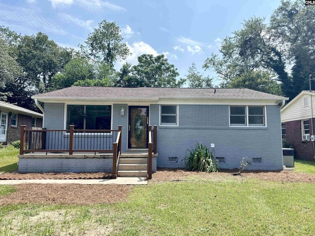 single story home with central air condition unit, covered porch, brick siding, crawl space, and a front yard