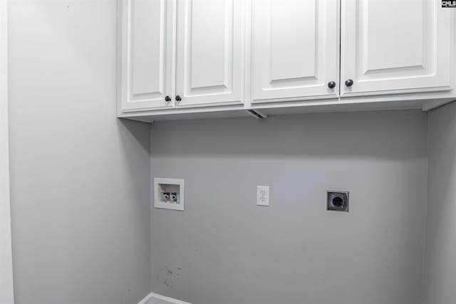 washroom featuring cabinet space, hookup for a washing machine, and electric dryer hookup