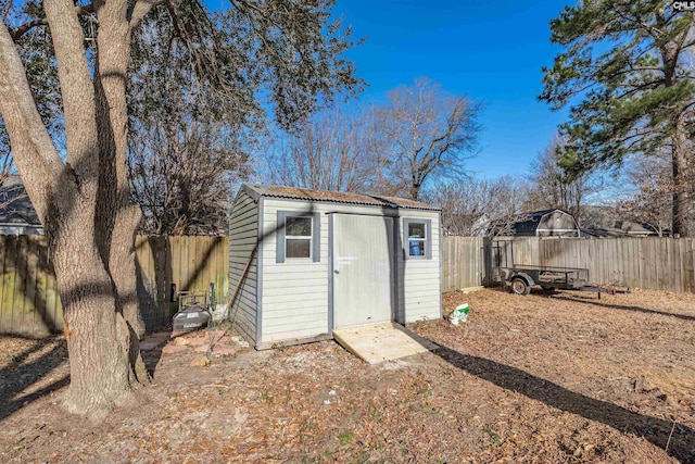 view of shed with a fenced backyard