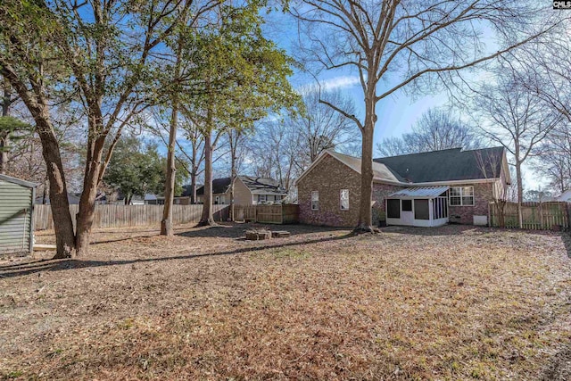 exterior space with fence private yard and brick siding