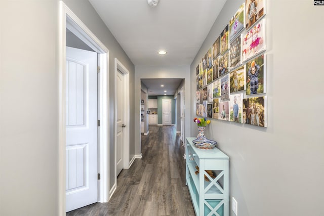 hall with baseboards, dark wood-type flooring, and recessed lighting